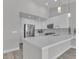 Contemporary kitchen showcasing sleek white cabinetry, stainless steel appliances, and quartz countertops at 918 Ambusher St, Henderson, NV 89014