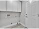 Functional laundry area with built-in cabinets and a convenient exterior door at 918 Ambusher St, Henderson, NV 89014