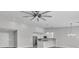 Bright, open-concept living space with a modern kitchen, stainless steel appliances, and stylish pendant lighting at 918 Ambusher St, Henderson, NV 89014