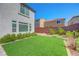 Expansive backyard with well-manicured lawn and mature landscaping at 10325 Quartz Reef Ct, Las Vegas, NV 89141
