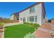 Serene backyard with artificial grass and landscaped surroundings at 10325 Quartz Reef Ct, Las Vegas, NV 89141