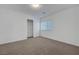 Simple bedroom featuring carpet floors, a closet and bright walls at 10325 Quartz Reef Ct, Las Vegas, NV 89141