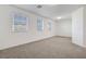 Bright bedroom with carpet, three large windows and natural light at 10325 Quartz Reef Ct, Las Vegas, NV 89141