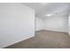 A spacious room that features carpeted floors and bright white walls at 10325 Quartz Reef Ct, Las Vegas, NV 89141
