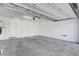 Clean and empty garage features concrete floors and a white door at 10325 Quartz Reef Ct, Las Vegas, NV 89141