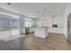 Modern kitchen featuring stainless steel appliances, granite countertops, and an island with pendant lighting at 10325 Quartz Reef Ct, Las Vegas, NV 89141