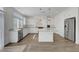 Well-equipped kitchen boasts stainless steel appliances, granite countertops, and an island with bar seating at 10325 Quartz Reef Ct, Las Vegas, NV 89141