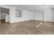 Spacious living room with stylish wood-style tile floors, creating a welcoming and modern atmosphere at 10325 Quartz Reef Ct, Las Vegas, NV 89141