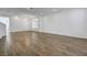 Spacious living room boasts wood-look tile flooring and neutral paint at 10325 Quartz Reef Ct, Las Vegas, NV 89141