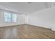 Bright living room with wood-look tile flooring and lots of natural light at 10325 Quartz Reef Ct, Las Vegas, NV 89141