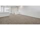 Second view of loft area with neutral carpet and white walls at 10325 Quartz Reef Ct, Las Vegas, NV 89141