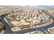 Aerial view of community including swimming pools, clubhouse, landscaping, and surrounding homes at 10623 Kearney Mountain Ave, Las Vegas, NV 89166