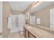 The bathroom has a single vanity, granite counters, framed mirror, and shower-tub combo at 10623 Kearney Mountain Ave, Las Vegas, NV 89166
