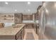 Well-equipped kitchen featuring granite countertops, stainless steel appliances, and dark cabinets at 10623 Kearney Mountain Ave, Las Vegas, NV 89166