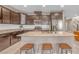 Modern kitchen with granite countertops, stainless steel appliances, and dark wood cabinets creating a chef-friendly space at 10623 Kearney Mountain Ave, Las Vegas, NV 89166