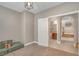 Playroom featuring neutral walls and carpeted floors with access to a bathroom and views of the upper staircase at 10623 Kearney Mountain Ave, Las Vegas, NV 89166