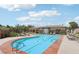 A sparkling pool features lap lanes and plenty of lounge chairs to relax by the pool on a sunny day at 10623 Kearney Mountain Ave, Las Vegas, NV 89166