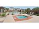 Community spa and pool area with lounge chairs and well-maintained landscaping, ideal for relaxation and enjoyment at 10623 Kearney Mountain Ave, Las Vegas, NV 89166