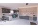 Modern kitchen featuring stainless steel appliances, recessed lighting, and an island cooktop at 1860 Old West Ave, Pahrump, NV 89048
