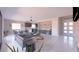 Open concept living room and kitchen featuring light colored floors and recessed lighting at 1860 Old West Ave, Pahrump, NV 89048