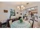Bright dining area with an open view to the modern kitchen, adorned with tasteful decor at 1897 Holdenville St, Henderson, NV 89052