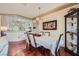 Bright dining area with hardwood floors, stylish lighting fixture, and decorative display cabinet at 1897 Holdenville St, Henderson, NV 89052