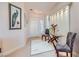 Welcoming foyer with decorative chairs, glass table, peacock art and tile accents at 1897 Holdenville St, Henderson, NV 89052