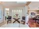 Elegant foyer featuring paneled wall accents, seating, and views into the dining and living spaces at 1897 Holdenville St, Henderson, NV 89052