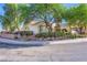 Corner lot property with mature trees and manicured landscaping and charming exterior paint at 1897 Holdenville St, Henderson, NV 89052