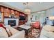 Cozy living room with a fireplace, custom built-ins, and an open layout, perfect for entertaining at 1897 Holdenville St, Henderson, NV 89052