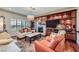 Comfortable living room featuring a fireplace, hardwood floors, and cozy seating arrangements at 1897 Holdenville St, Henderson, NV 89052