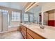 Bright bathroom featuring double sinks, soaking tub, and separate glass enclosed shower at 2016 Biloxi Pass, Henderson, NV 89052