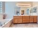 Bathroom features a soaking tub, double sink vanity, and great lighting at 2016 Biloxi Pass, Henderson, NV 89052