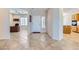 Inviting entryway featuring tile flooring, with a formal living room with desk and a view into the kitchen at 2016 Biloxi Pass, Henderson, NV 89052