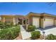 Charming single story home featuring a three-car garage, gated front yard and desert landscaping at 2016 Biloxi Pass, Henderson, NV 89052