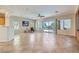 Spacious living room featuring tile floors, lots of natural light, and a sliding glass door to the backyard at 2016 Biloxi Pass, Henderson, NV 89052