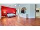 This bedroom features an accent wall, wood floors, and a ceiling fan at 2016 Biloxi Pass, Henderson, NV 89052