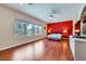 Spacious main bedroom features wood floors, a ceiling fan, and large windows with green views at 2016 Biloxi Pass, Henderson, NV 89052