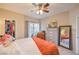 Bright bedroom features a walk-in closet, patio access, ceiling fan, and coordinated decor at 2050 W Warm Springs Rd # 1923, Henderson, NV 89014