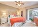 Comfortable bedroom with a plush bed, walk-in closet, and sliding glass door to a private patio at 2050 W Warm Springs Rd # 1923, Henderson, NV 89014