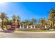 Beautiful community fountain surrounded by lush palm trees and well-manicured landscaping on a sunny day at 2050 W Warm Springs Rd # 1923, Henderson, NV 89014