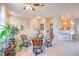 Bright dining area featuring a glass table set for four, with views of kitchen and ample natural light at 2050 W Warm Springs Rd # 1923, Henderson, NV 89014
