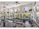Community gym with modern equipment, natural light, and mirrored walls at 2050 W Warm Springs Rd # 1923, Henderson, NV 89014