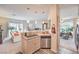 Open concept kitchen with stainless steel appliances and views of the living and dining areas at 2050 W Warm Springs Rd # 1923, Henderson, NV 89014
