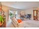 Bright living room with a fireplace and open access to the outdoors at 2050 W Warm Springs Rd # 1923, Henderson, NV 89014