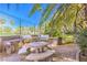 Community outdoor grill and eating area with seating under palm trees at 2050 W Warm Springs Rd # 1923, Henderson, NV 89014