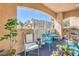Charming patio area with stylish furniture, plants, and decorative privacy screen at 2050 W Warm Springs Rd # 1923, Henderson, NV 89014