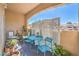 Relaxing patio with cozy seating, decorative screen, and serene outdoor ambiance at 2050 W Warm Springs Rd # 1923, Henderson, NV 89014