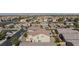 Aerial view of a single-Gathering home with a private backyard, manicured lawn, and a refreshing swimming pool at 210 Red Sandstone Ave, North Las Vegas, NV 89031