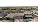 Aerial view of backyard featuring a cozy patio area, above ground pool, and well-maintained landscaping at 210 Red Sandstone Ave, North Las Vegas, NV 89031